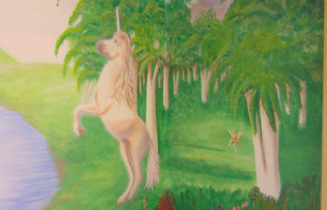 Fantasy mural with unicorn in the woods.